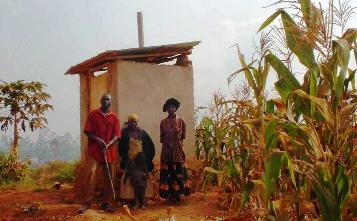 JjaJja (center) and her latrine before the bath house was added.